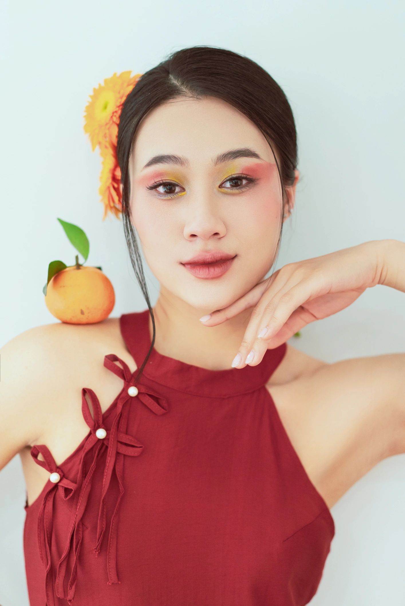 Woman with expressive makeup and floral beauty styling