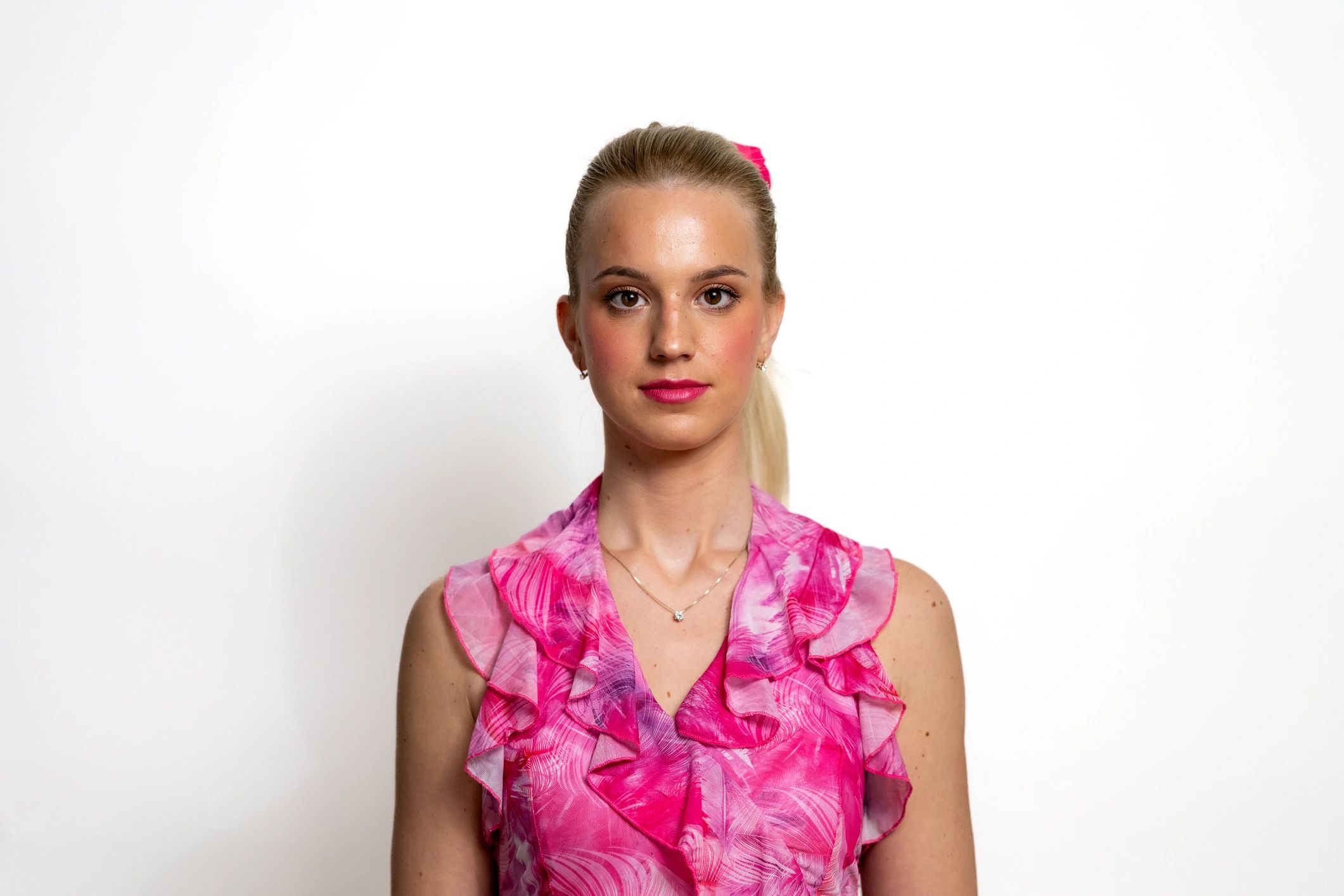 Editorial fashion portrait in a pink dress